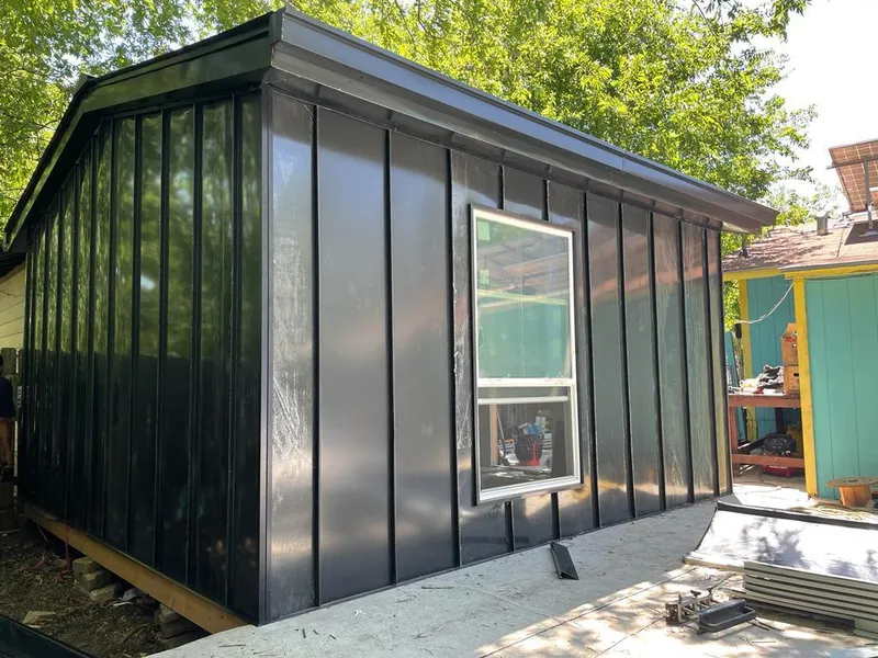 Black standing seam metal wall panels for Roof Inspection in Sergeant Bluff