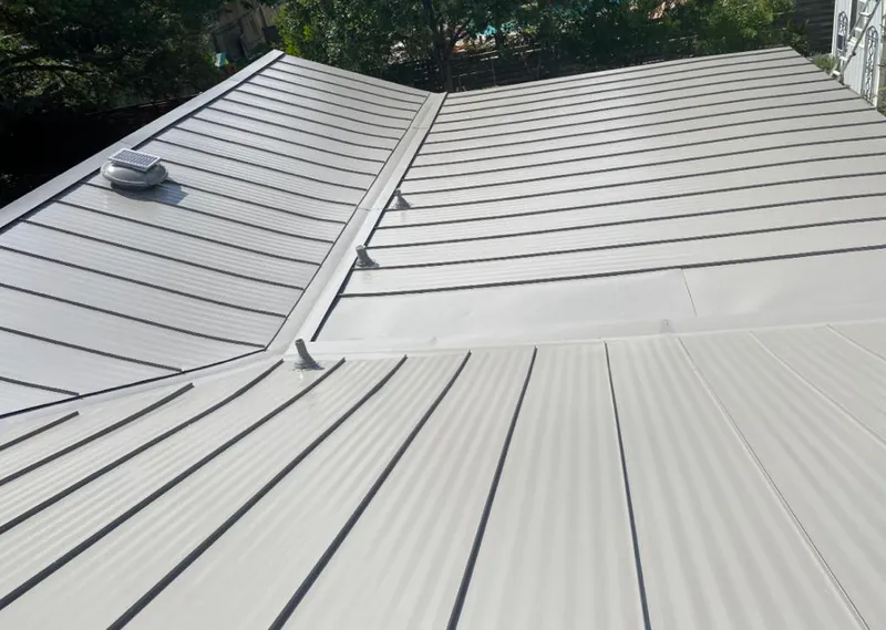 Solar attic fan installed on a metal roof for Roof Ventilation in Sergeant Bluff